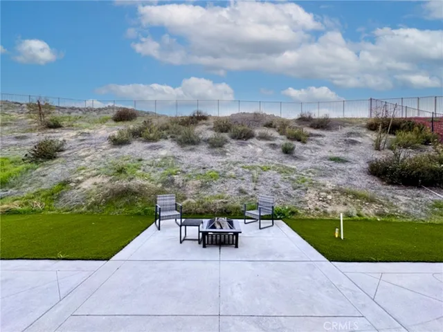 a view of an house with backyard space and garden