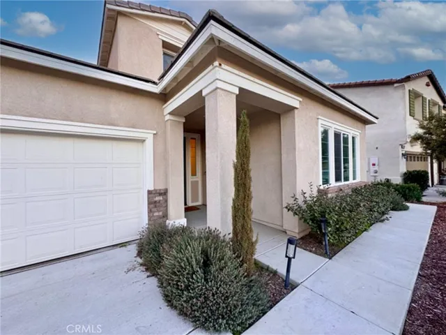 a view of front door with chandelier