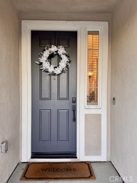 30411 Ridgecrest Road Winchester, CA 92596 - Photo 7 of 46 a view of front door with chandelier