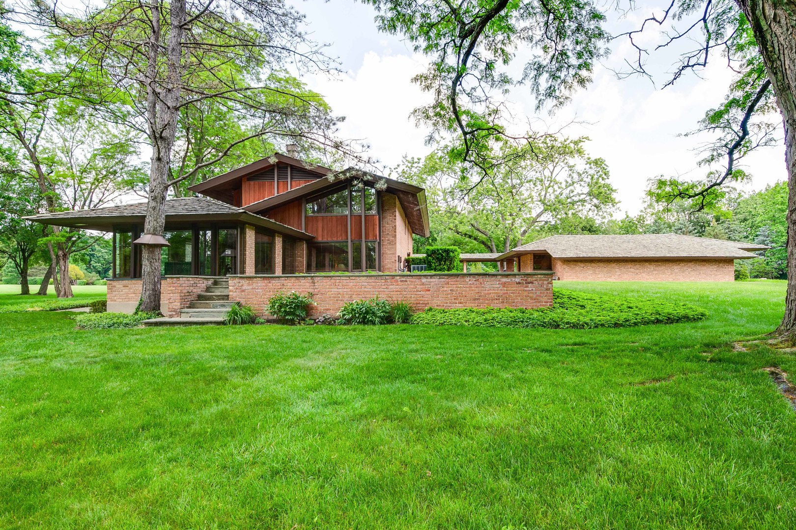 a view of a house with a yard porch and sitting area