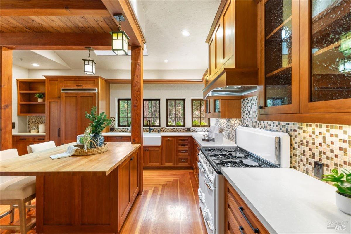 12076 Cloud Ridge Road Healdsburg, CA 95448 - Photo 15 of 72 Ample counter space and additional storage on far side of fridge leaving to a door to access the patio.