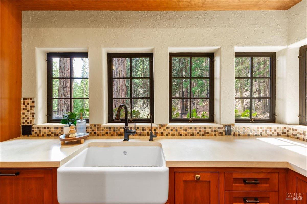 12076 Cloud Ridge Road Healdsburg, CA 95448 - Photo 16 of 72 Farmhouse sink with a view overlooking trees, gardens, and sunshine.