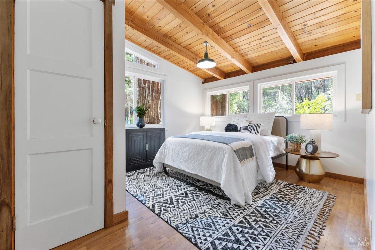 12076 Cloud Ridge Road Healdsburg, CA 95448 - Photo 48 of 72 Downstairs bedroom with large windows, hard floors, and a closet.