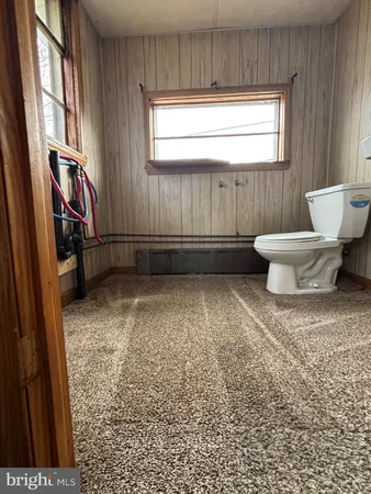 a view of an empty room with windows