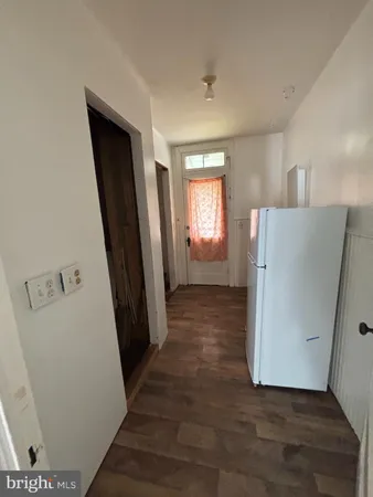a bathroom with a toilet a sink and a window