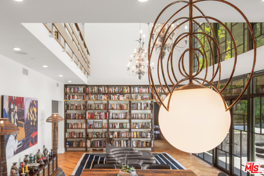 16001 Woodvale Road Encino, CA 91436 - Photo 12 of 49 wooden floor with a book shelf