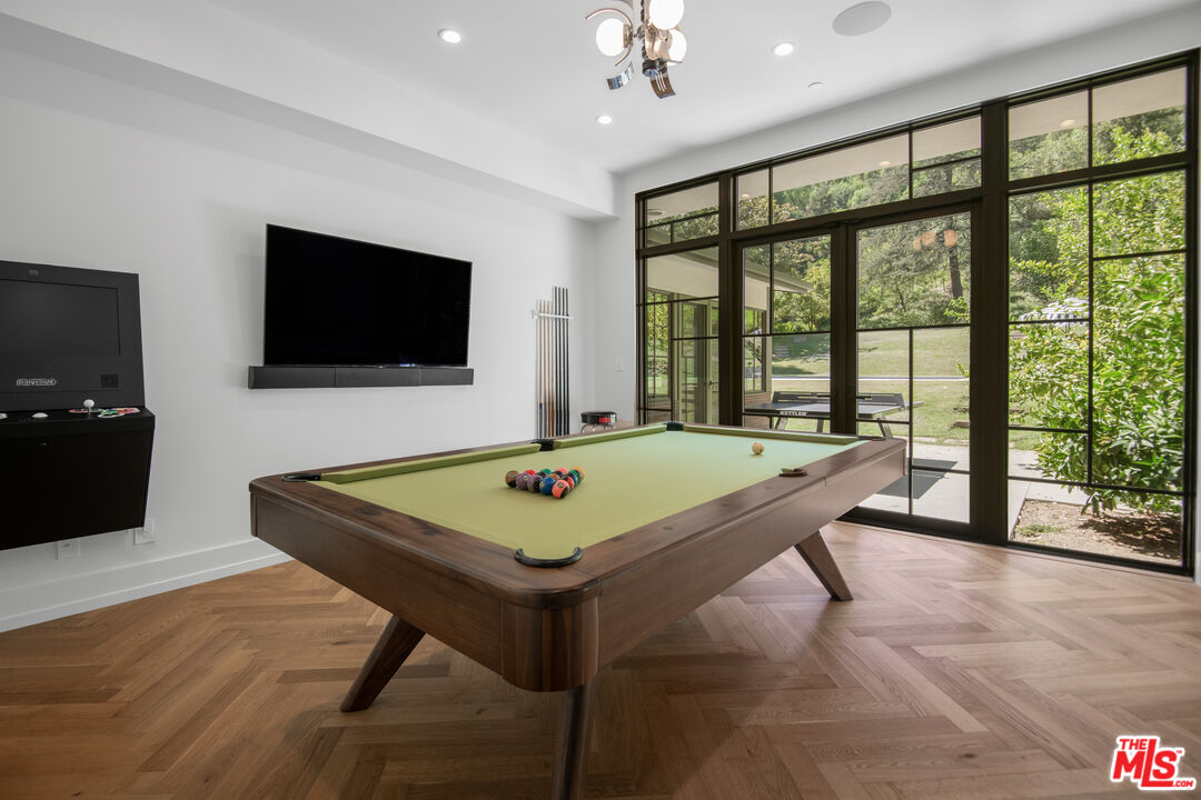 16001 Woodvale Road Encino, CA 91436 - Photo 17 of 49 a room with pool table and windows