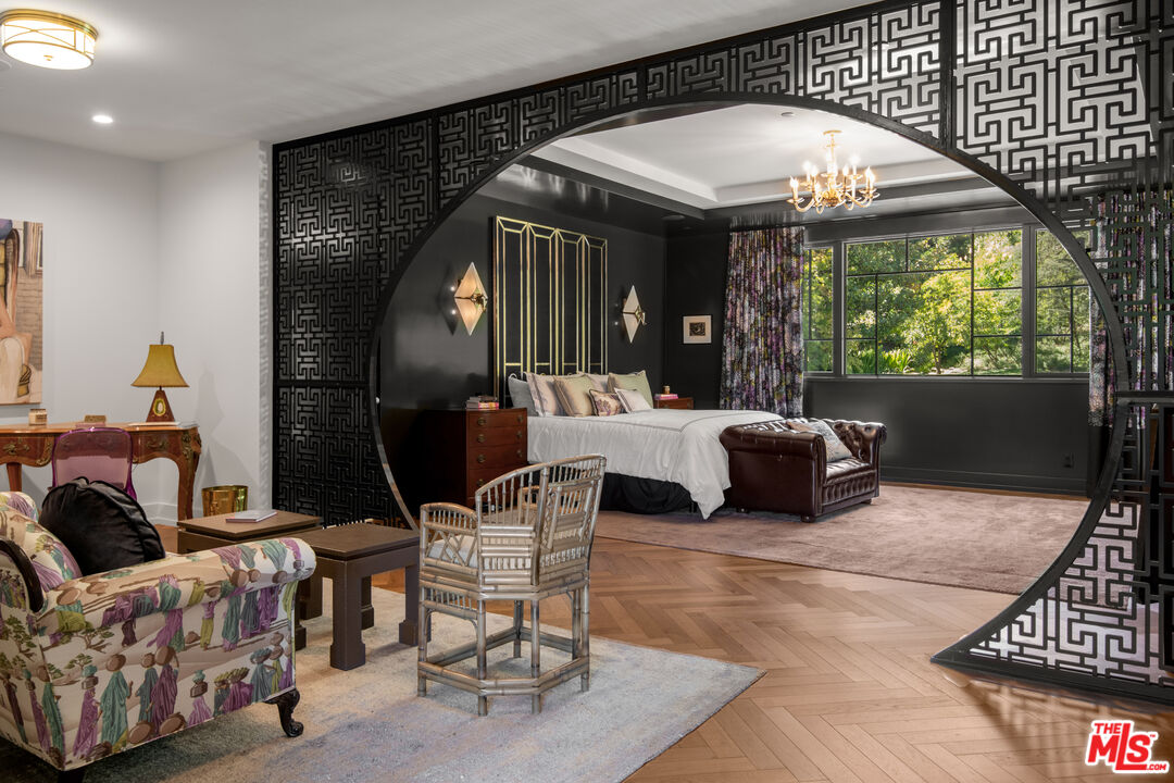 16001 Woodvale Road Encino, CA 91436 - Photo 19 of 49 a living room with furniture and a large window