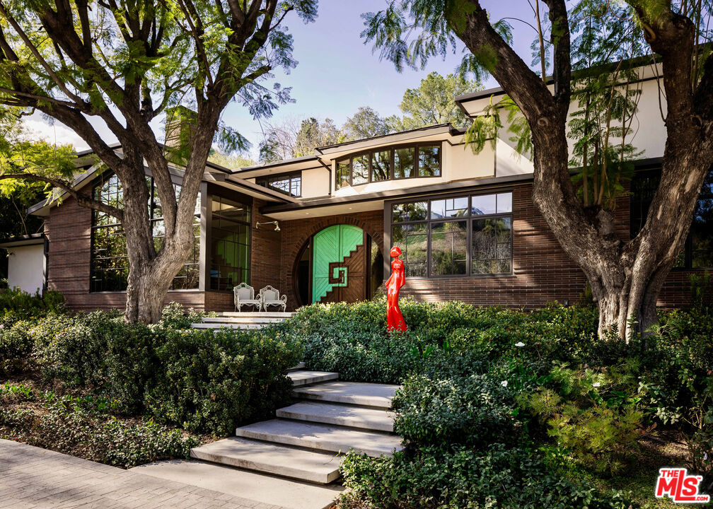 16001 Woodvale Road Encino, CA 91436 - Photo 2 of 49 front view of a house with a tree