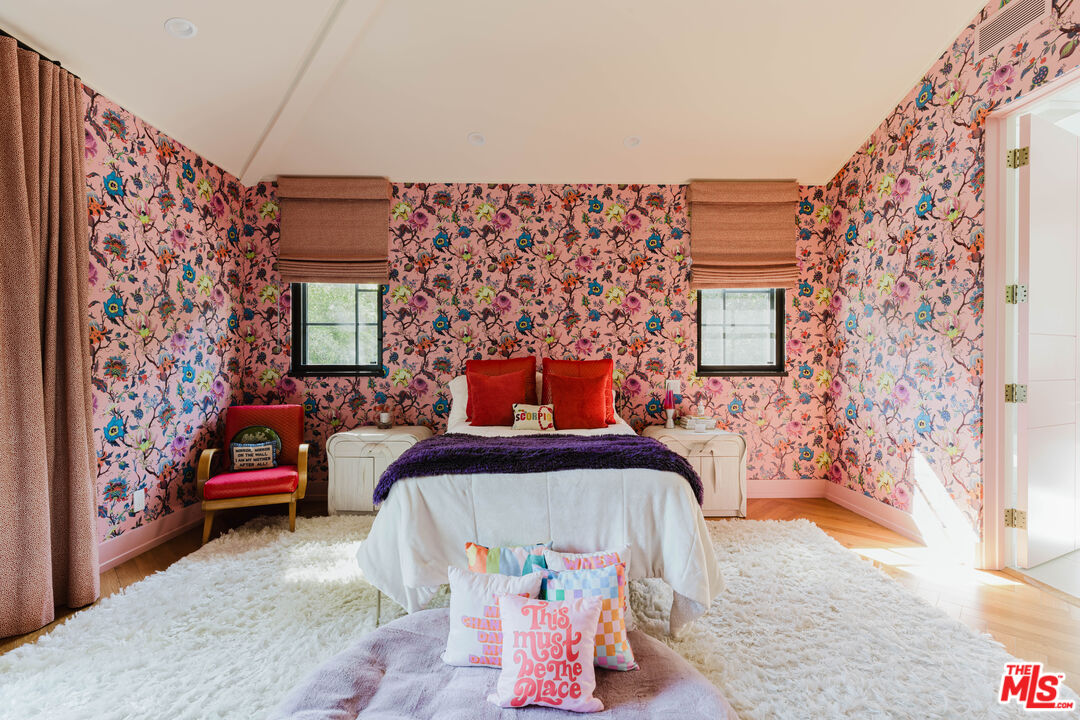 16001 Woodvale Road Encino, CA 91436 - Photo 25 of 49 a bedroom with a bed and a chair