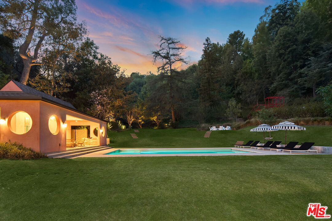 16001 Woodvale Road Encino, CA 91436 - Photo 25 of 26 a view of a house with a big yard