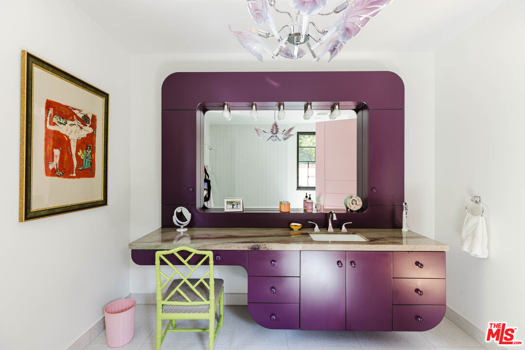 16001 Woodvale Road Encino, CA 91436 - Photo 26 of 49 a bathroom with a sink mirror and vanity