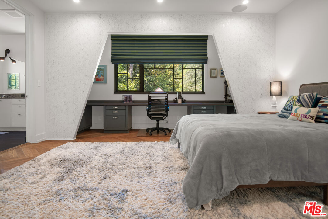 16001 Woodvale Road Encino, CA 91436 - Photo 28 of 49 a bed sitting in a bedroom next to a window