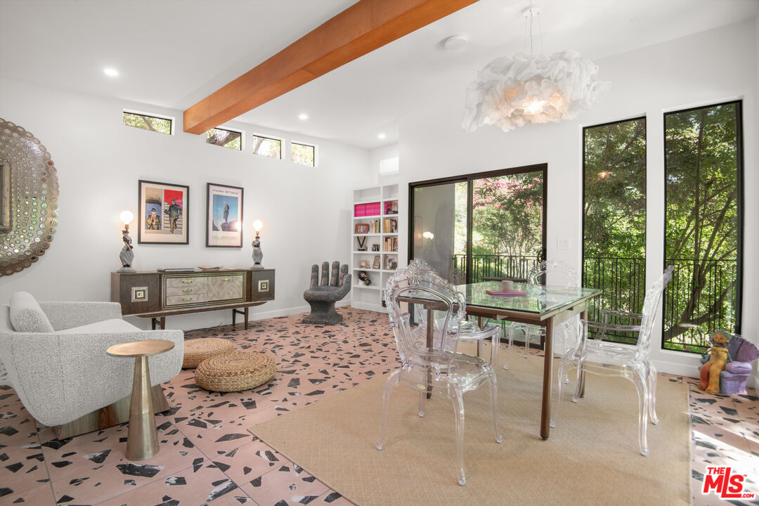 16001 Woodvale Road Encino, CA 91436 - Photo 39 of 49 a living room with furniture and a large window