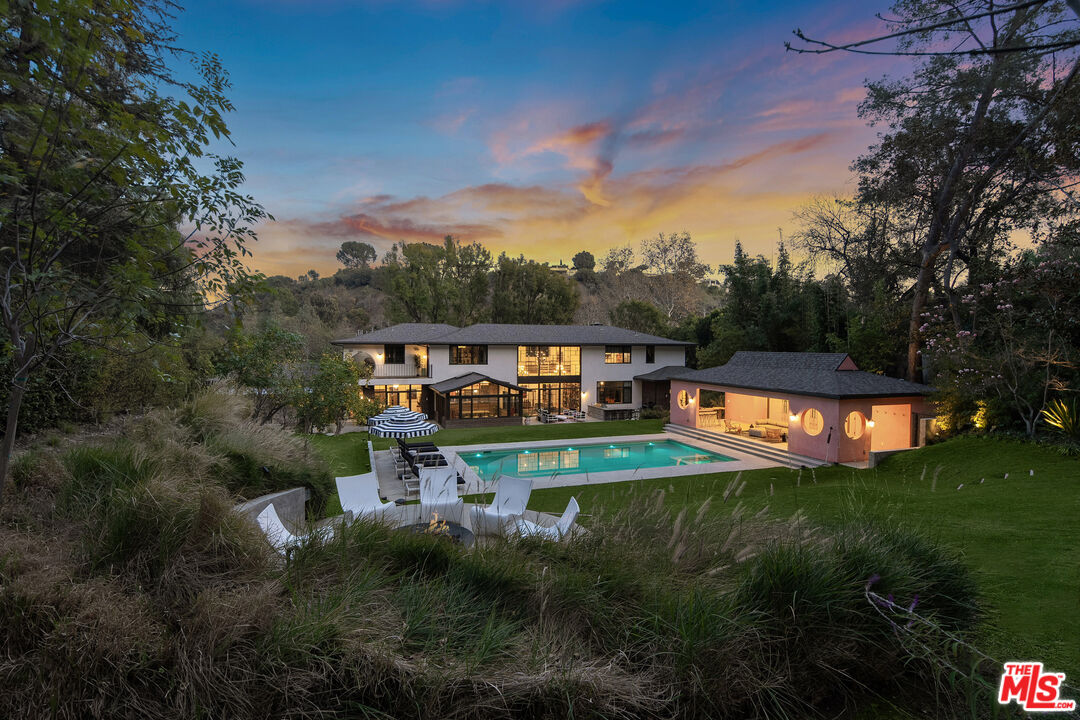 16001 Woodvale Road Encino, CA 91436 - Photo 43 of 49 a view of house with garden space and deck