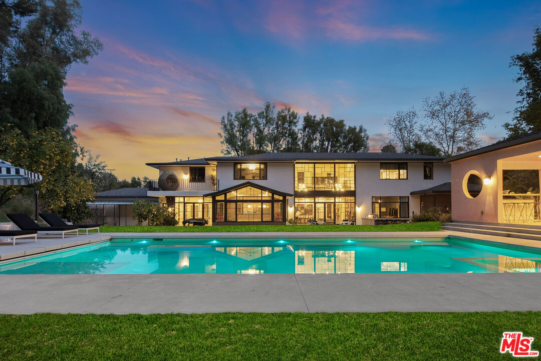 16001 Woodvale Road Encino, CA 91436 - Photo 46 of 49 a front view of a house with garden
