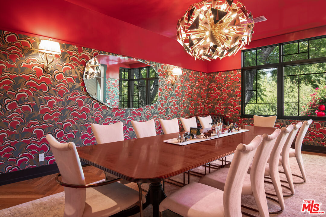 16001 Woodvale Road Encino, CA 91436 - Photo 7 of 49 a view of a dining room with furniture and a floor to ceiling window