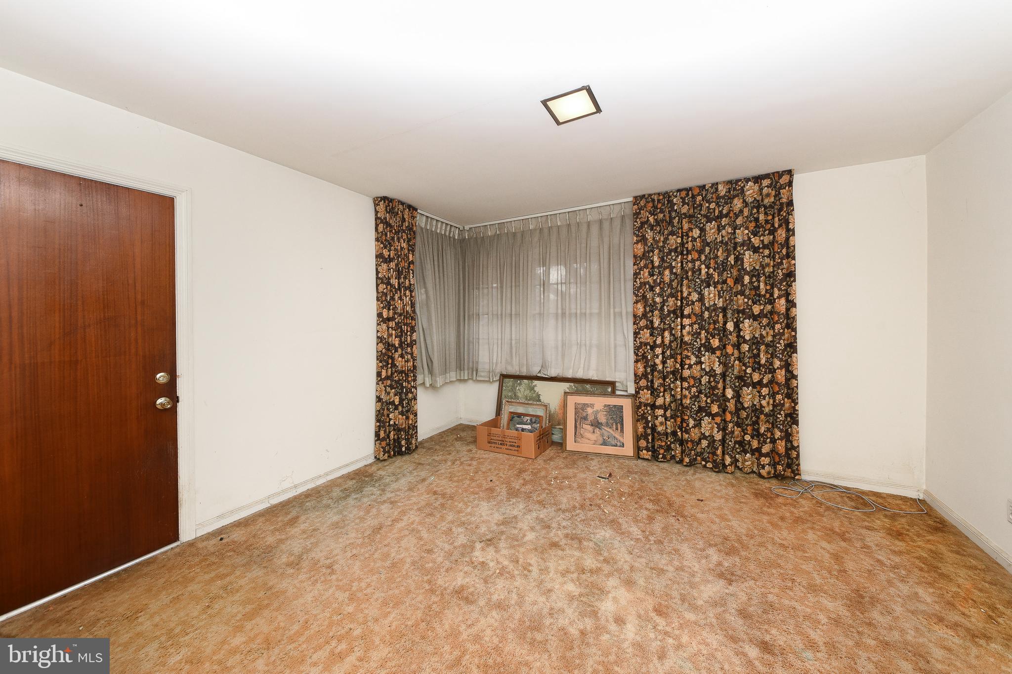1 Sunnyside Lane Yardley, PA 19067 - Photo 11 of 39 a view of an empty room with a fireplace and a window