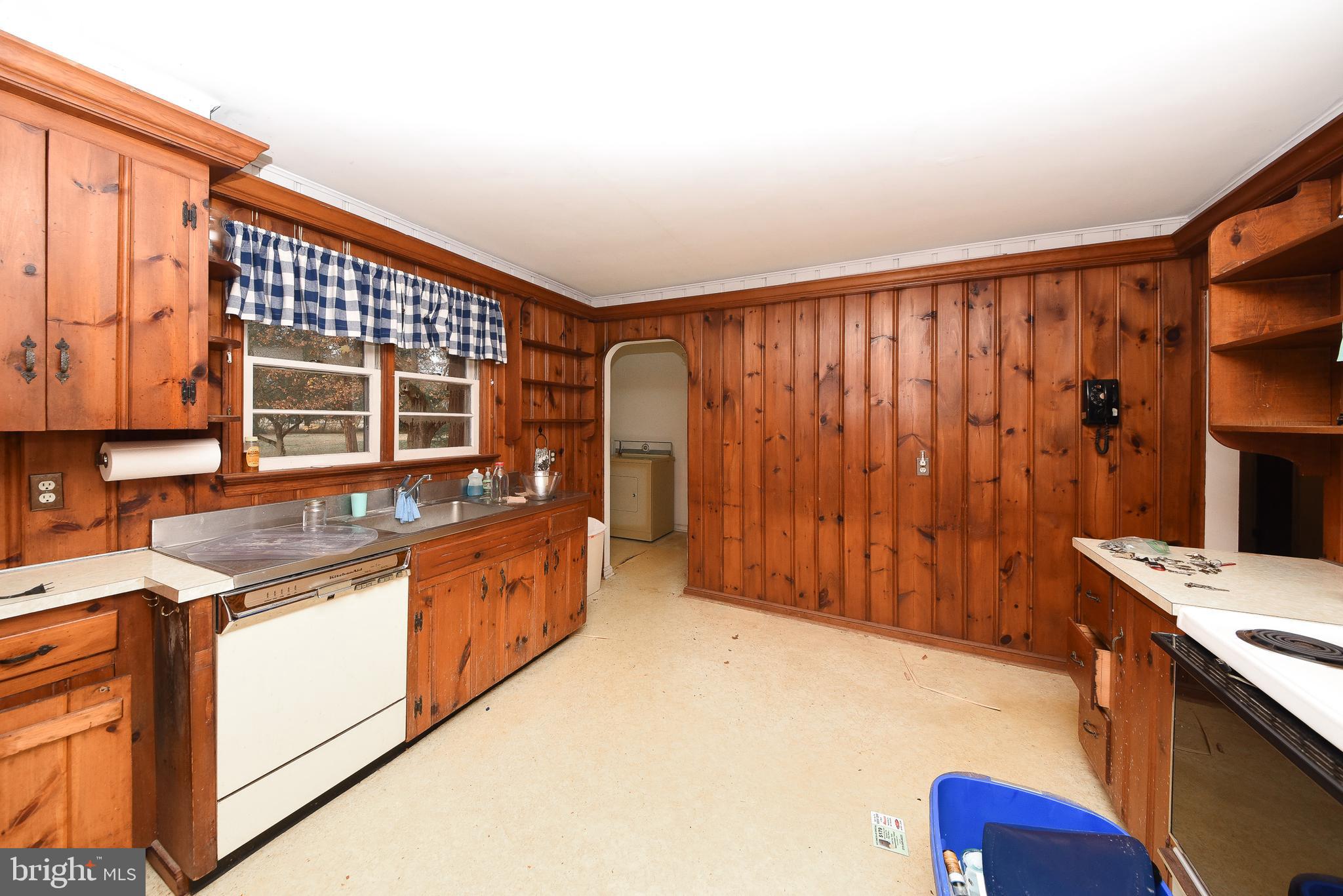 1 Sunnyside Lane Yardley, PA 19067 - Photo 13 of 39 a kitchen with stainless steel appliances granite countertop a stove a sink and a microwave