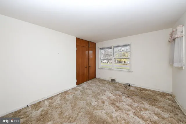 a view of an empty room and window