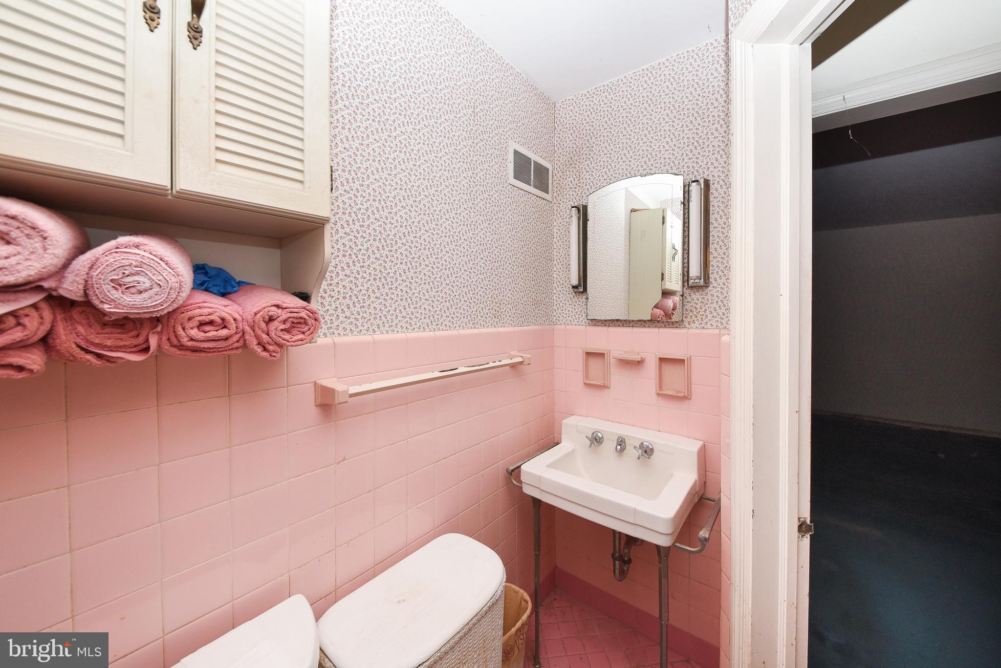 1 Sunnyside Lane Yardley, PA 19067 - Photo 26 of 39 a bathroom with a sink a mirror and toilet