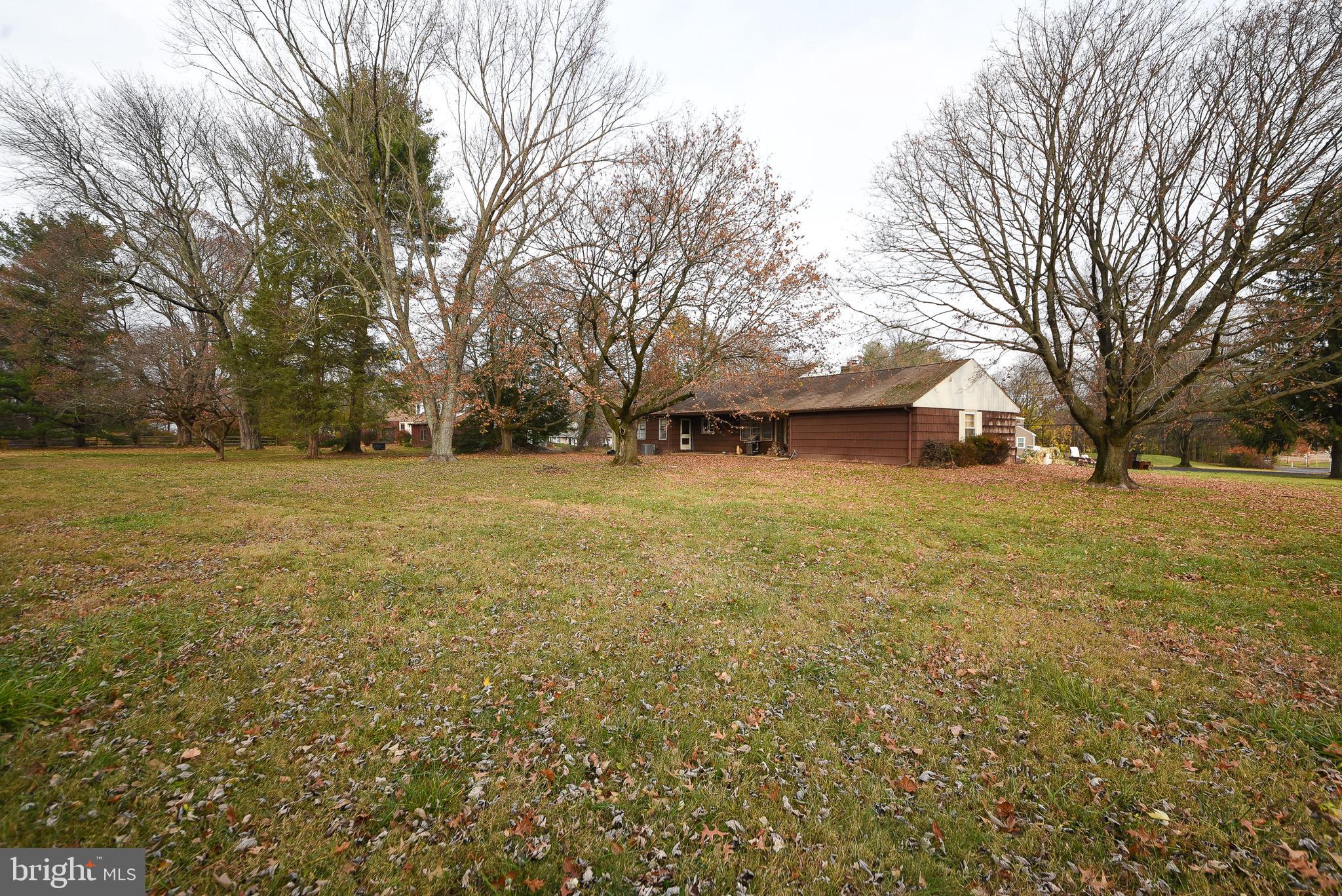 1 Sunnyside Lane Yardley, PA 19067 - Photo 36 of 39 a view of a field with trees in the background
