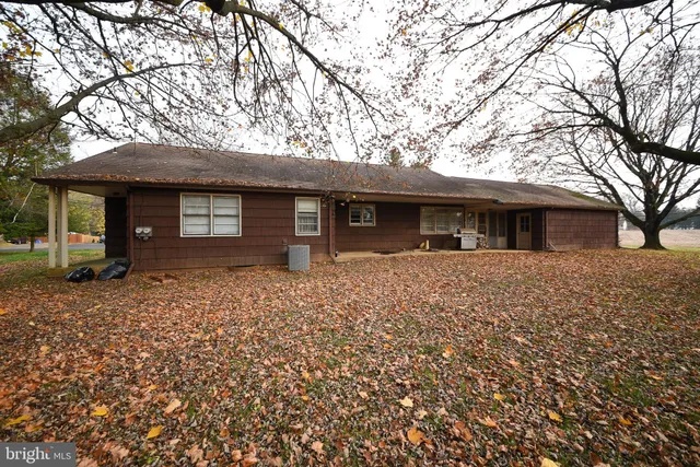 a view of outdoor space with deck and trees