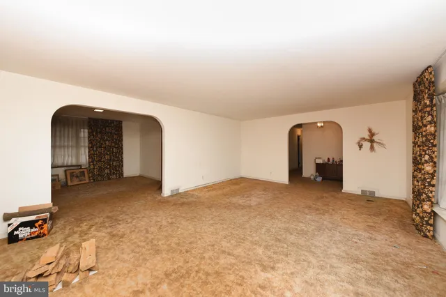 a view of a livingroom with a staircase