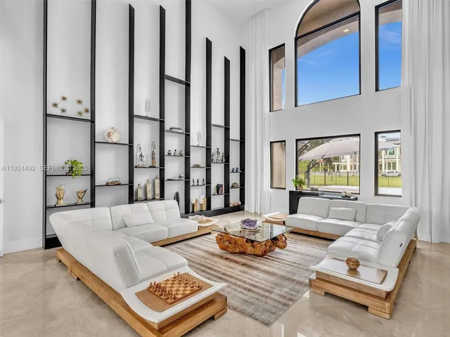 a kitchen with stainless steel appliances a sink stove and cabinets
