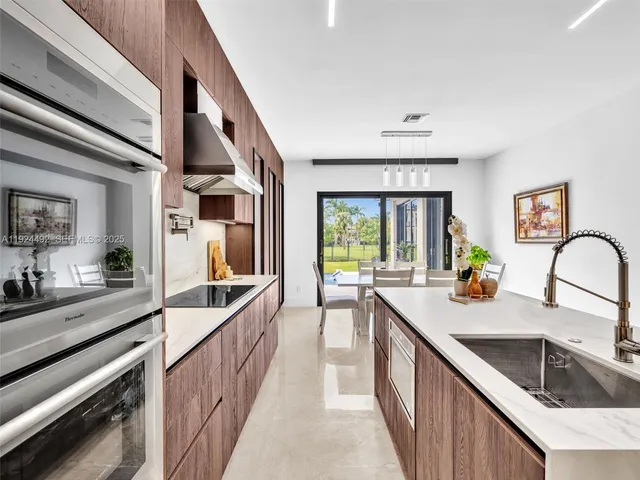 a view of a house with roof deck and sitting area