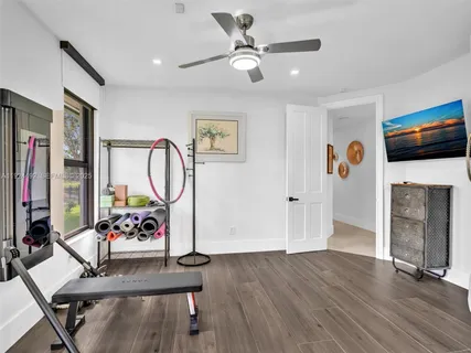 a view of a chairs and table in patio with a lake view