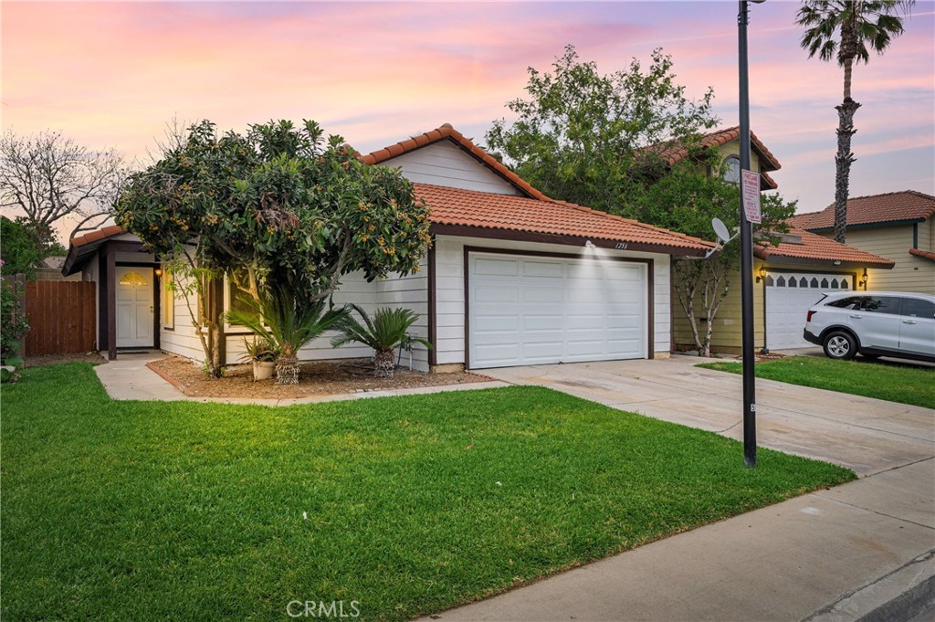 1256 West Morgan Street Rialto, CA 92376 - Photo 1 of 1 a view of a house with a yard and tree s