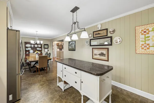 a bedroom with a bed and a table