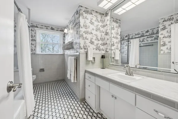 a front view of house with a garden