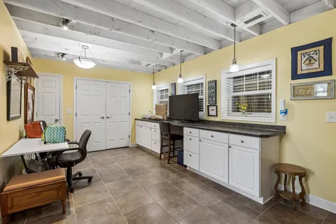 a kitchen with sink cabinets and appliances