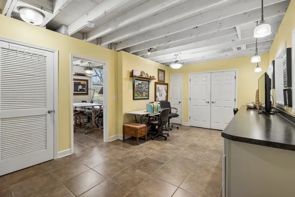 a view of a patio with table and chairs