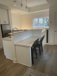 a kitchen with a sink and a microwave
