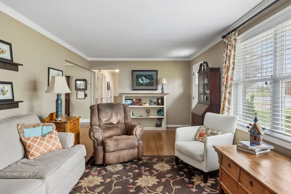 a kitchen with stainless steel appliances granite countertop a refrigerator a sink a stove and a refrigerator