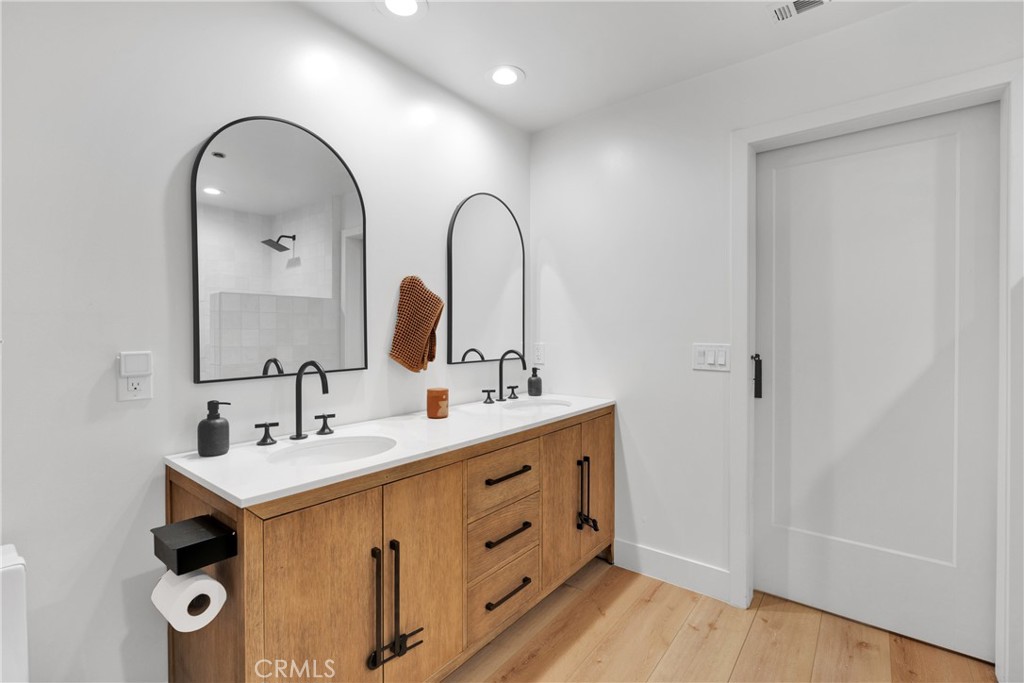 2128 Pheasant Road Wrightwood, CA 92397 - Photo 21 of 52 a bathroom with a double vanity sink and mirror
