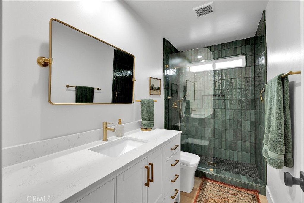 2128 Pheasant Road Wrightwood, CA 92397 - Photo 32 of 52 a bathroom with a sink a toilet and shower