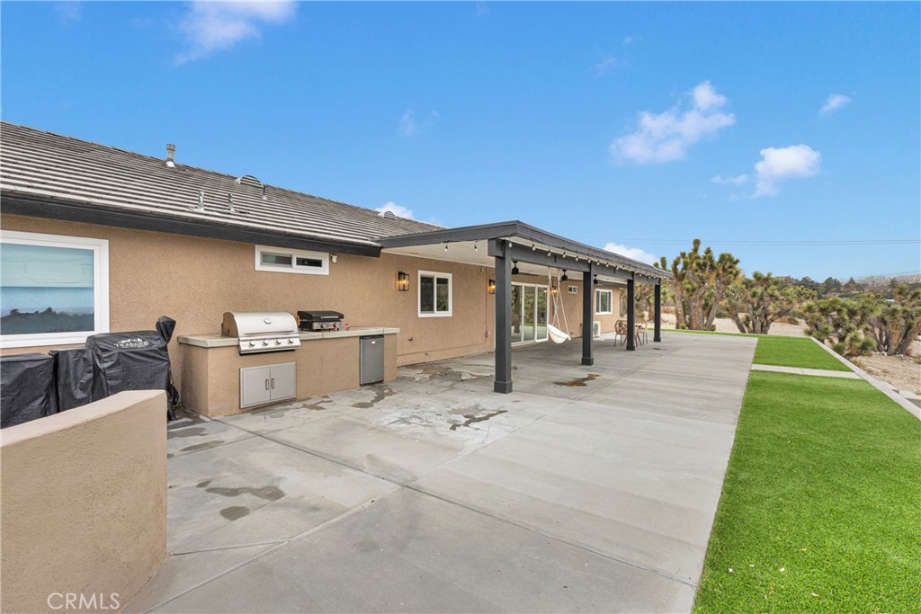 2128 Pheasant Road Wrightwood, CA 92397 - Photo 36 of 52 a view of a house with a patio