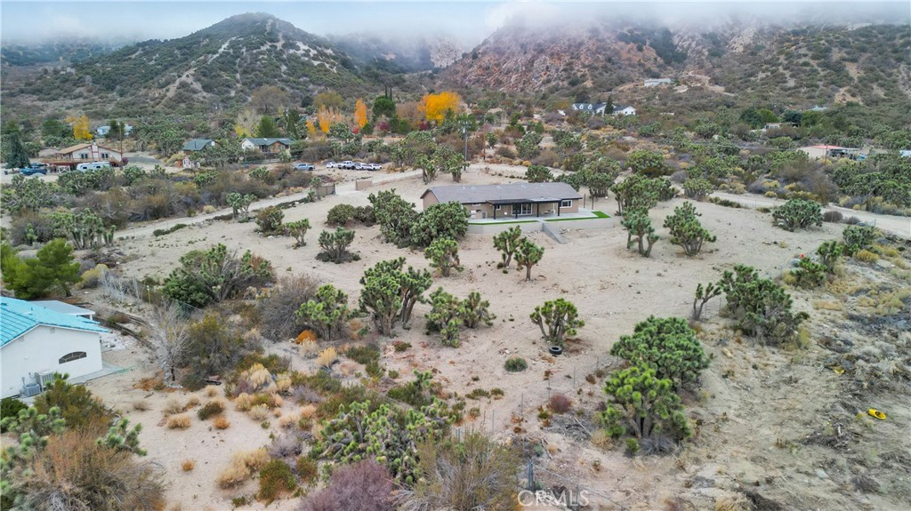 2128 Pheasant Road Wrightwood, CA 92397 - Photo 50 of 52 an aerial view of house with yard and mountain view in back