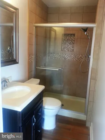 a bathroom with a shower and toilet