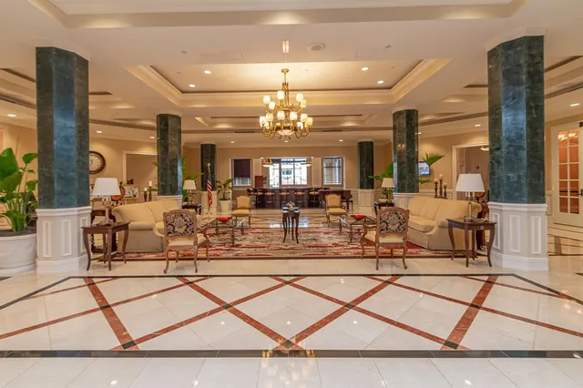 a view of a livingroom with furniture and a bookshelf