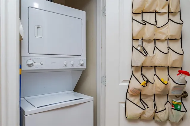 a close up view of a utility room with cabinets