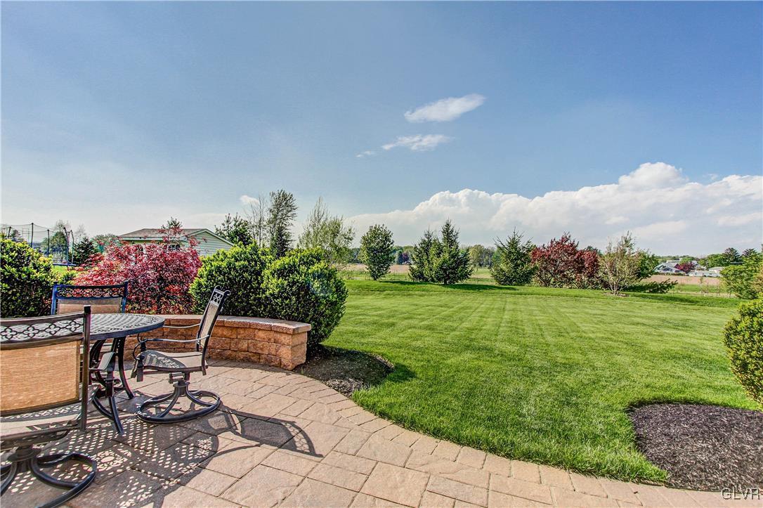 8935 Pathfinder Road Breinigsville, PA 18031 - Photo 50 of 50 Back Patio view to back yard and open space.