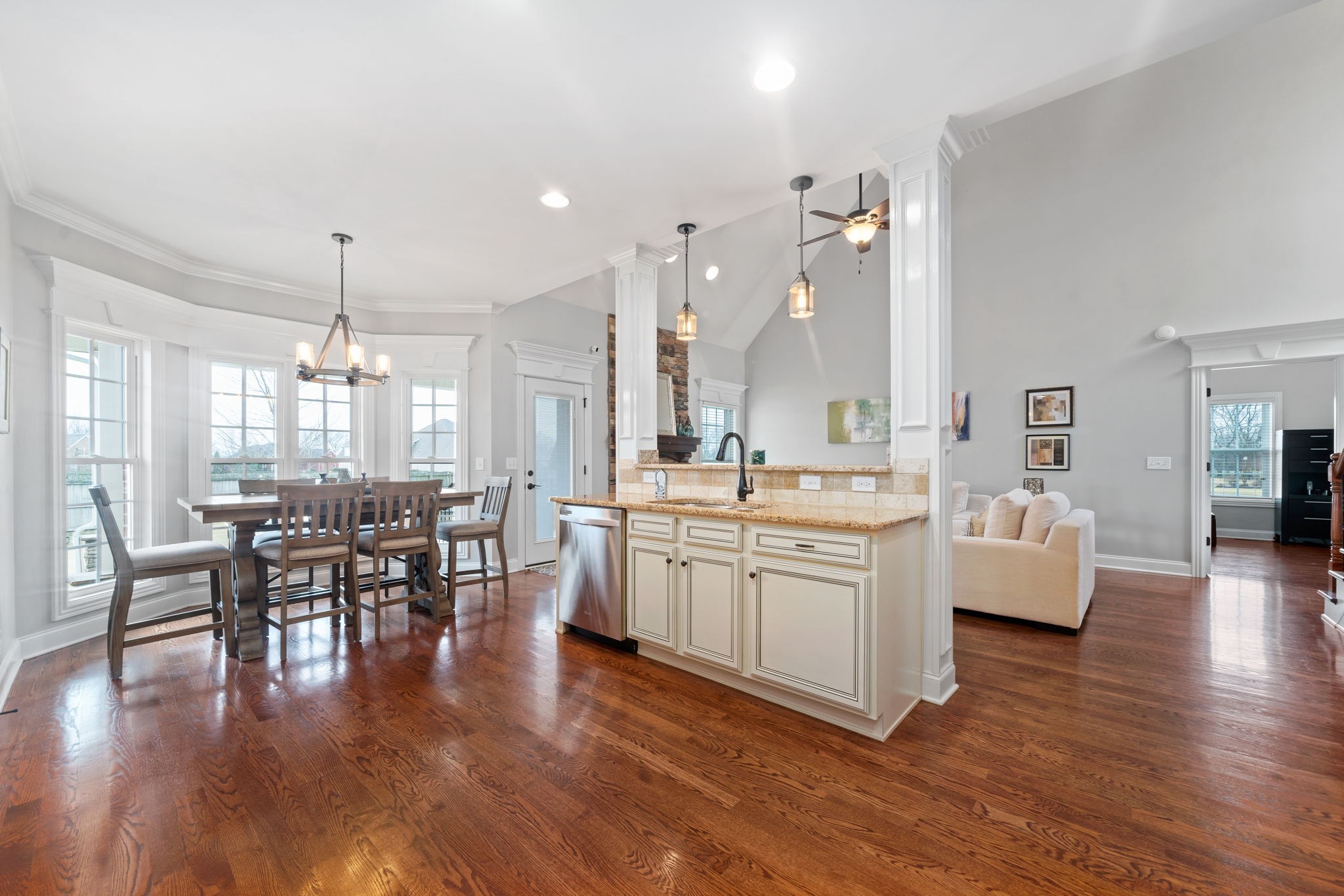 3927 Rowland Road Murfreesboro, TN 37128 - Photo 16 of 57 a large white kitchen with lots of counter space dining table and chairs