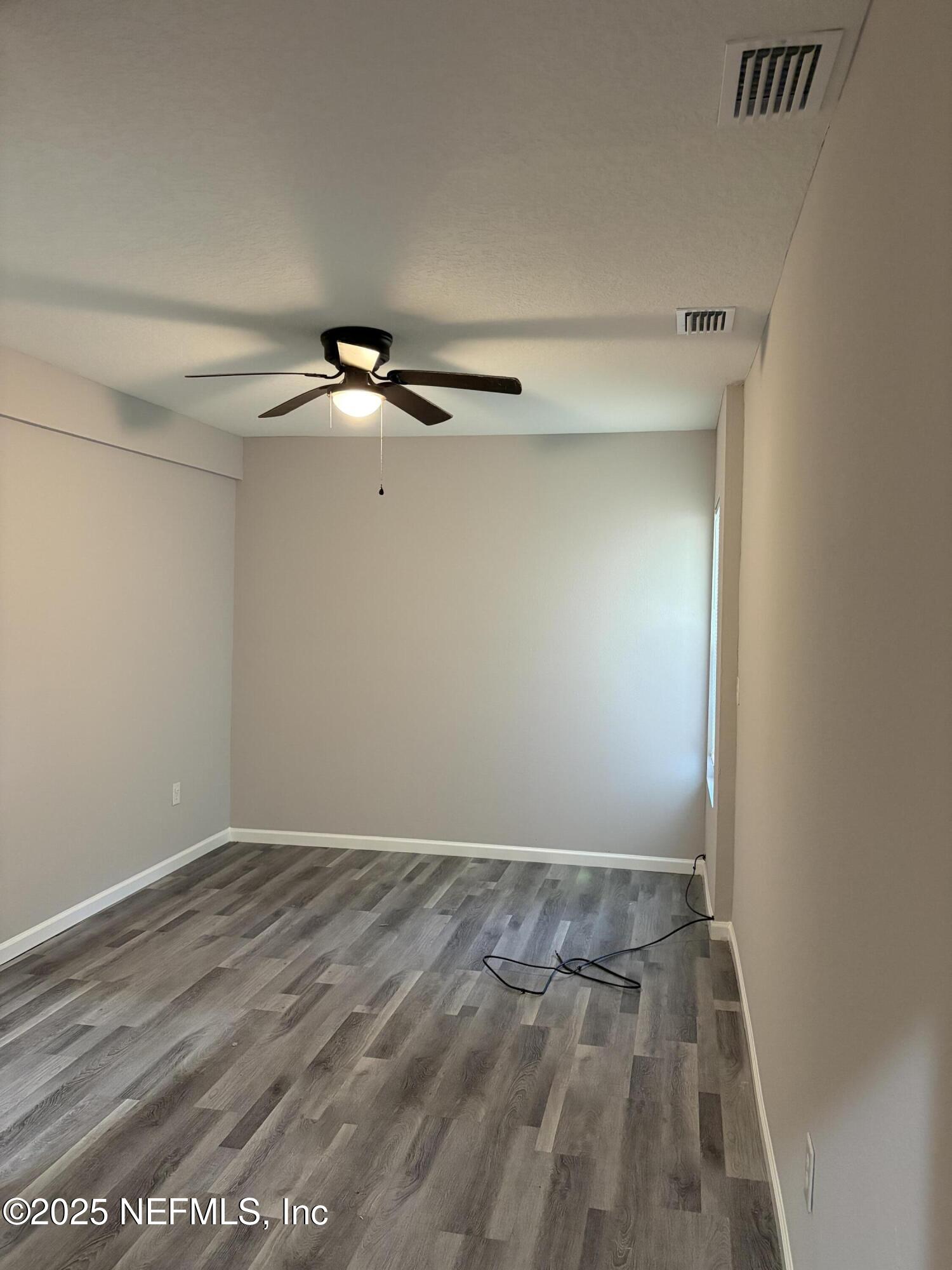 4444 Rainer Road Jacksonville, FL 32210 - Photo 9 of 19 wooden floor in a empty room