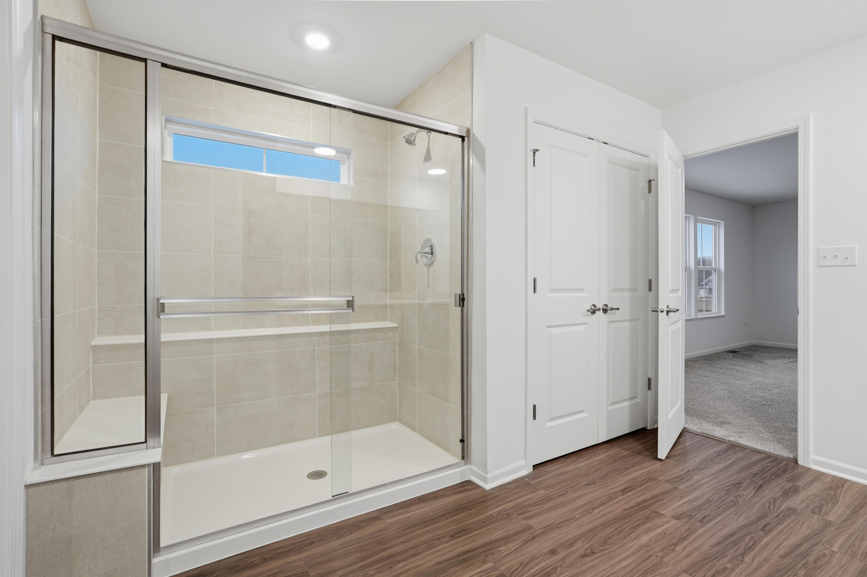 5970 East 112th Place Winfield, IN 46307 - Photo 11 of 57 a bathroom with a glass shower door
