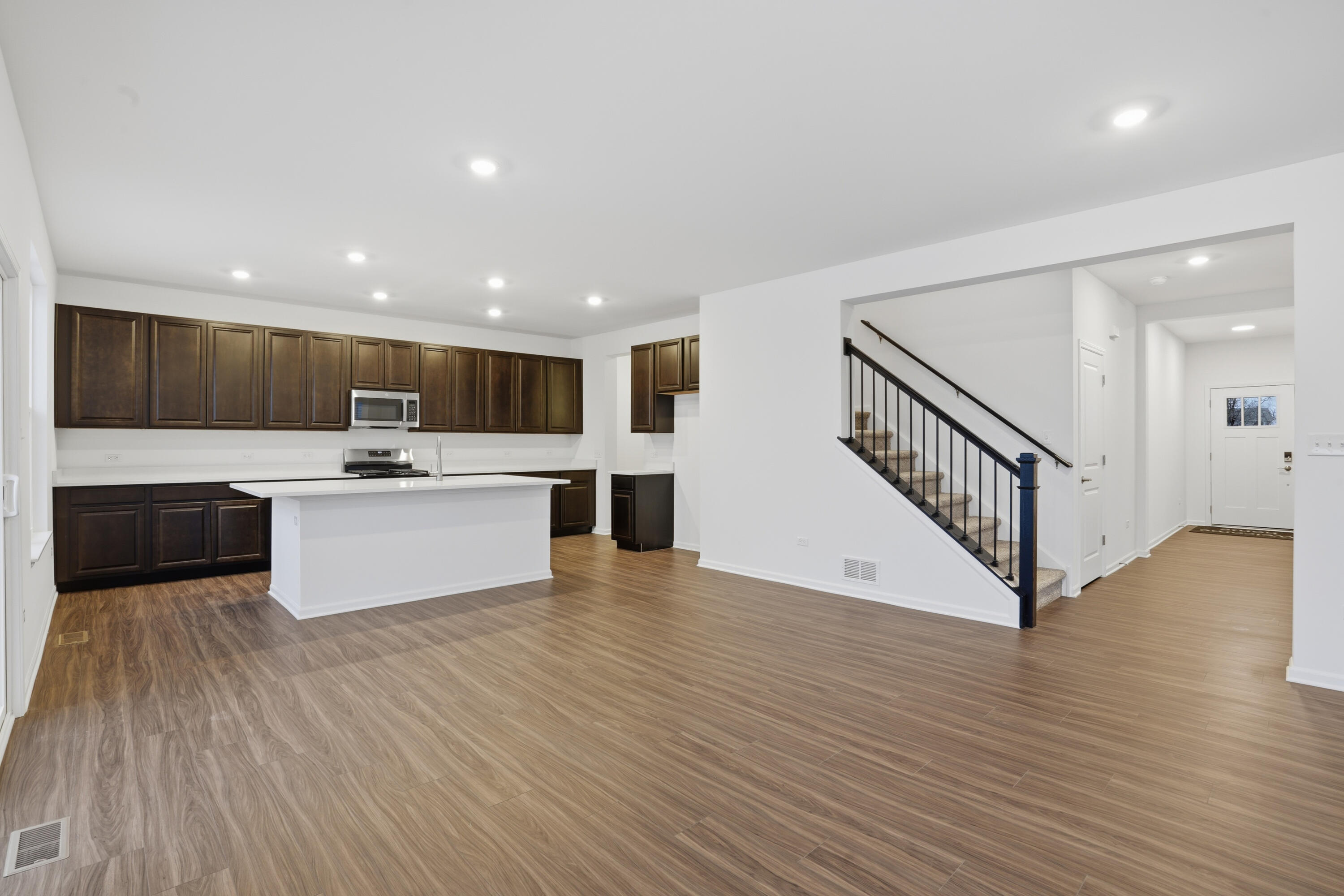 5970 East 112th Place Winfield, IN 46307 - Photo 3 of 57 a view of kitchen with wooden floor and electronic appliances